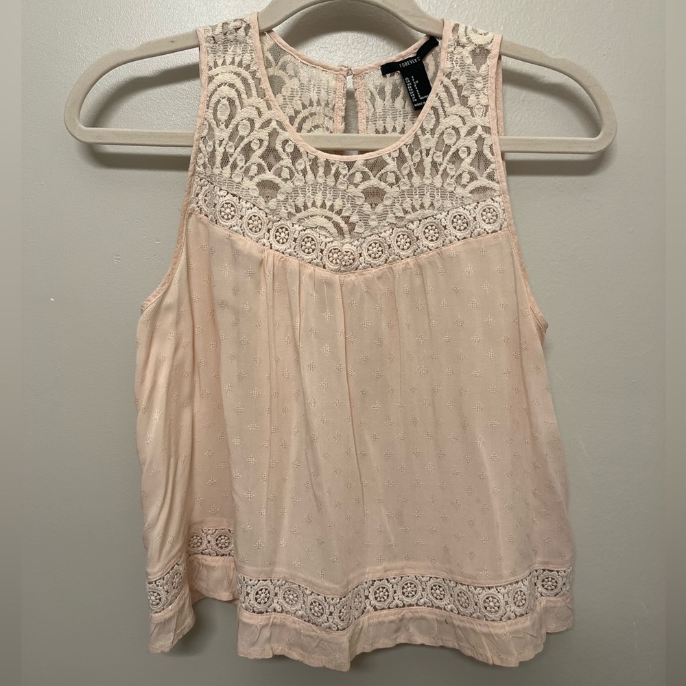Delicate Forever 21 Sleeveless Blouse. Light pink in color. Beautiful lace.